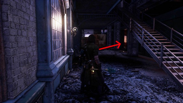 An arrow pointing to a train carriage containing Belle's partner Anderson in Lies of P