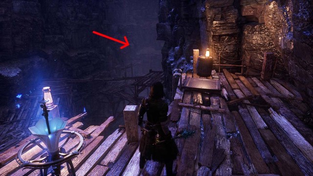 An arrow pointing to the back of Hermit's Cave in Lies of P