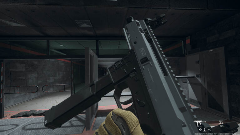 A first-person POV of inspecting the ISO 9mm in Call of Duty: Modern Warfare 2.