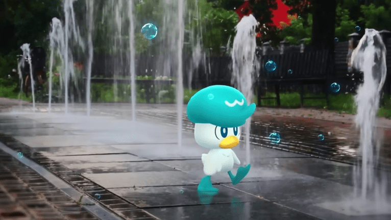 Quazkly walking through some water fountains.