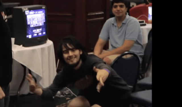 Image of Smash Bros player Mango, posing after winning a game.