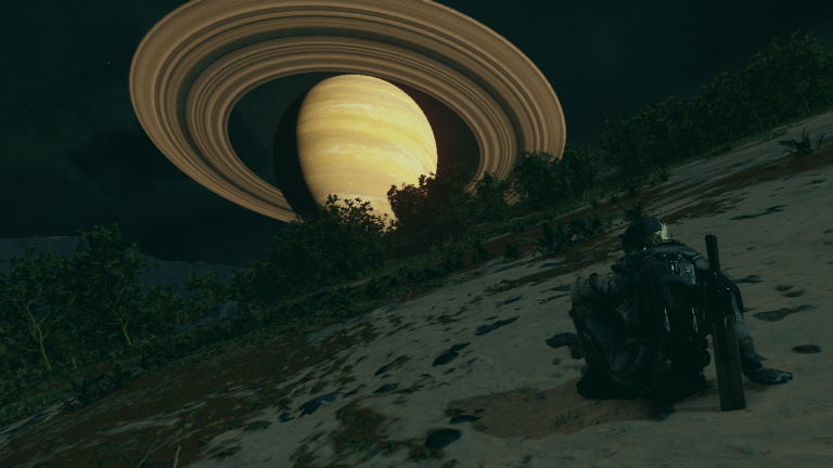 Displays a character sitting down and a ringed planet in the distance in Starfield.