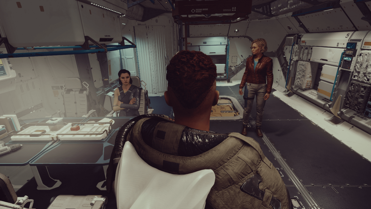 Displays the player character, Andreja, and Sarah Morgan on board the Frontier in Starfield.