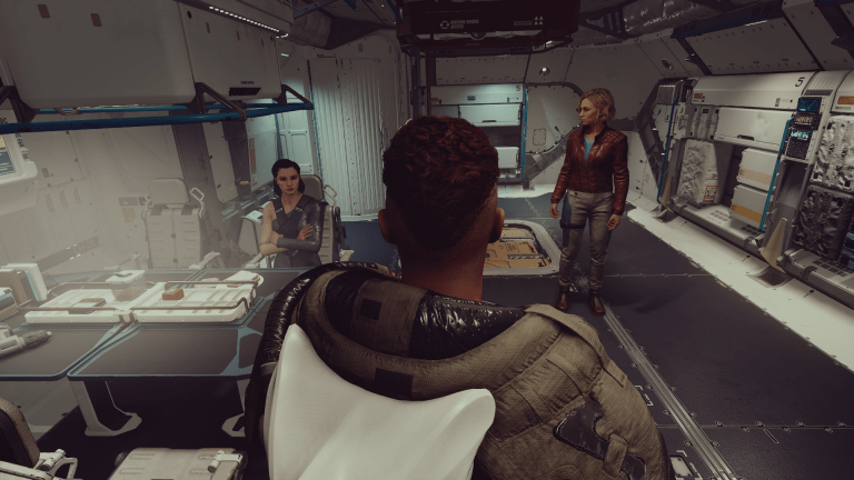 Displays the player character, Andreja, and Sarah Morgan on board the Frontier in Starfield.