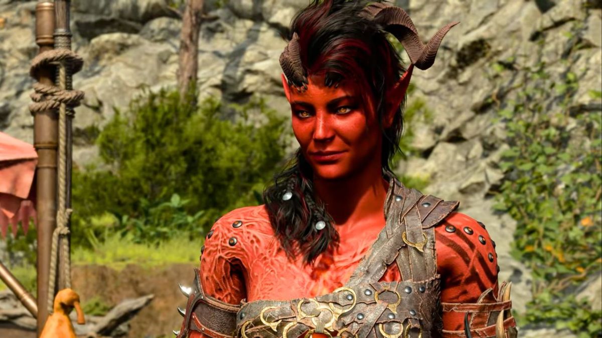 Woman with red skin and horns wearing leather outfit in BG3