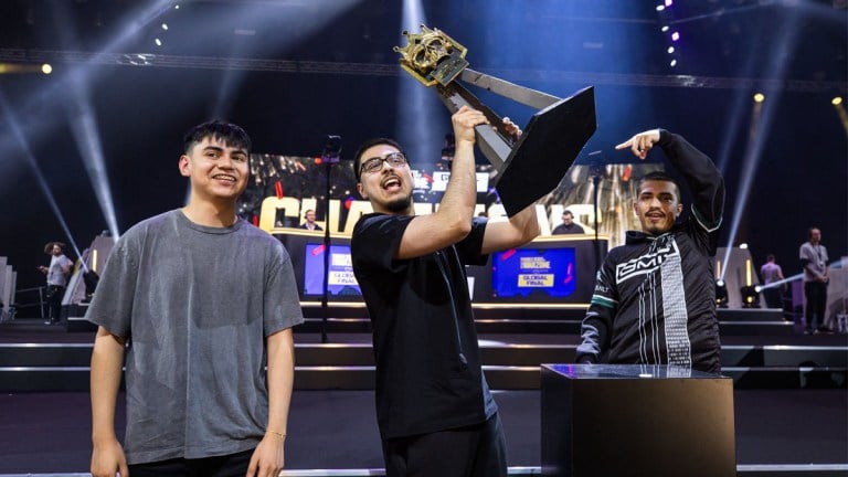 A player lifts a trophy alongside his teammates at the World Series of Warzone 2023 in London.