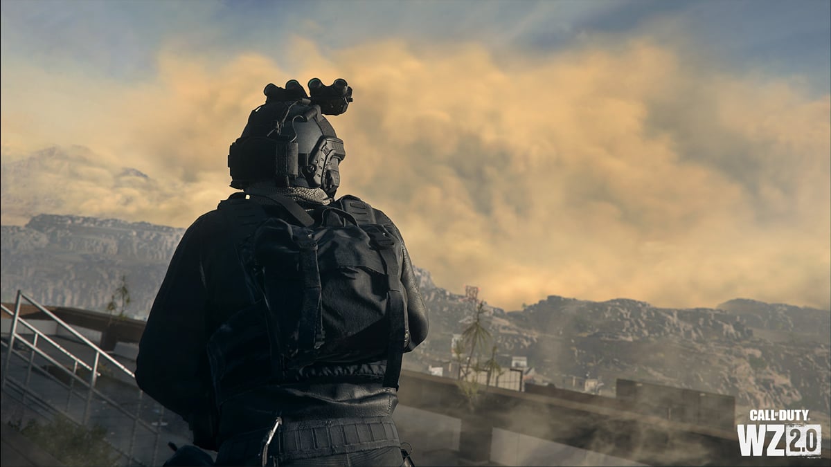 A soldier in all-black uniform stares to a city in the distance, engulfed in a duststorm in DMZ.