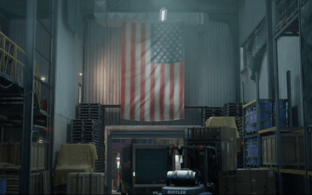 Warehouse with the items to steal inside with an american flag draped on the wall