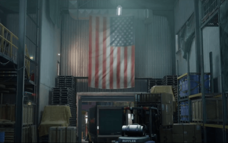 Warehouse with the items to steal inside with an american flag draped on the wall