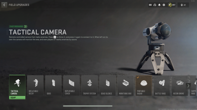 A screenshot of the Field Upgrade menu in DMZ, with the Tactical Camera, a small GoPro-like device, selected and displayed on the right with a tripod.