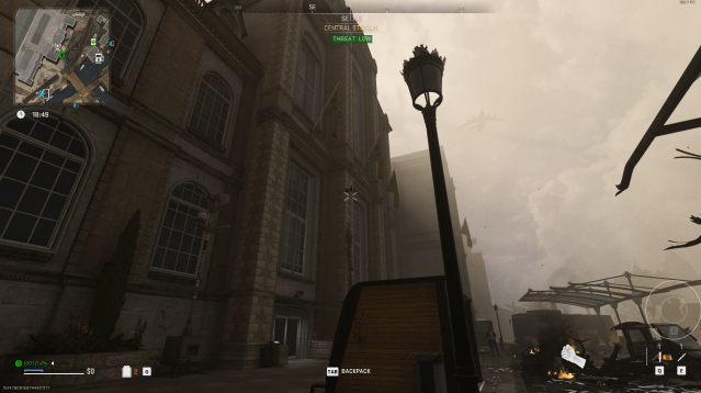 A lightpost outside a train station in Vondel, with a Gothic-inspired tower and a park bench in DMZ.