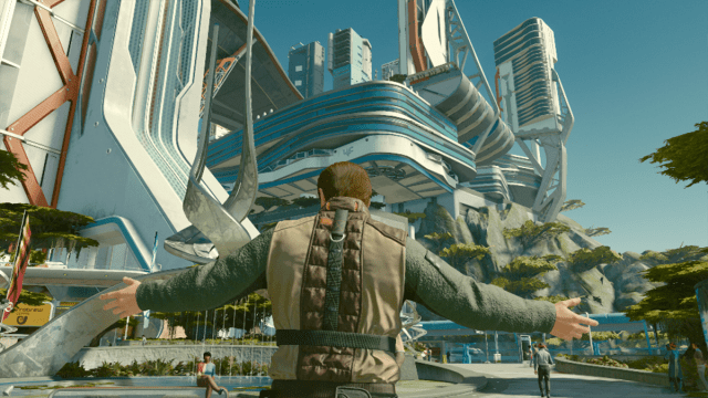 A character raises their arms as they stand in a courtyard of a futuristic city in Starfield.