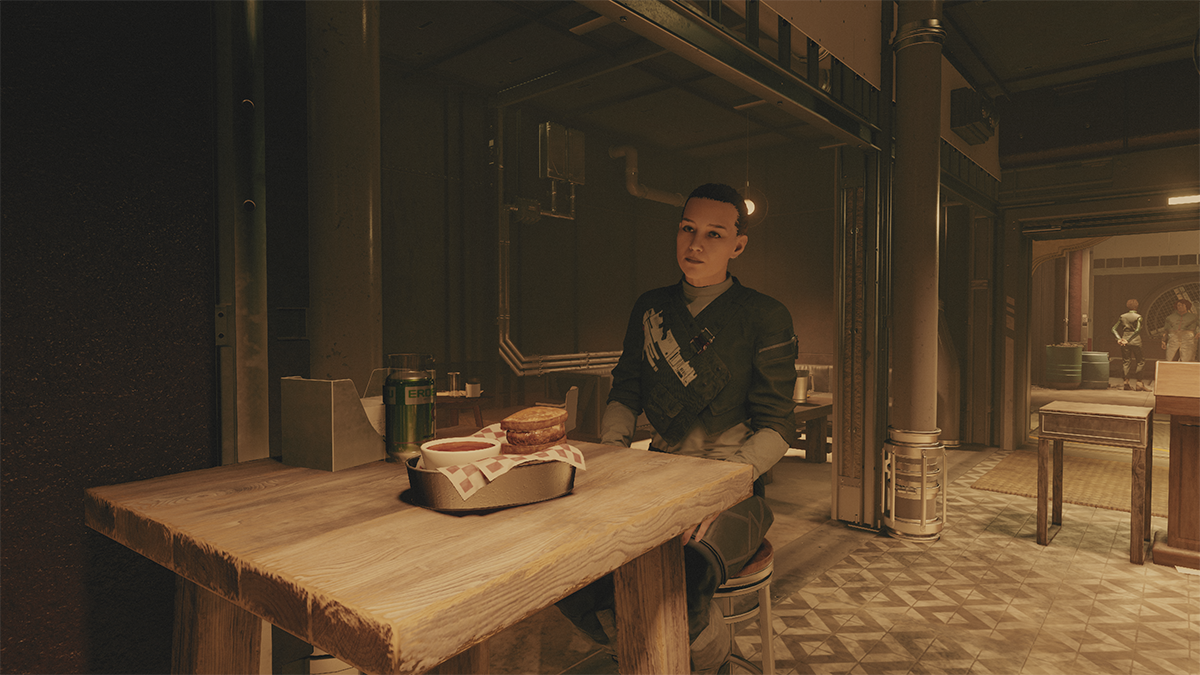 A woman sits at a table in a restaurant in Starfield. 