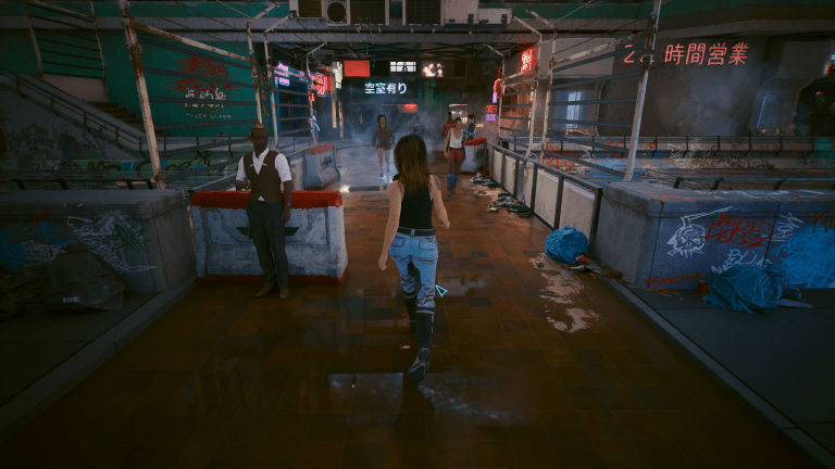 V walking through Night City in Cyberpunk 2077..