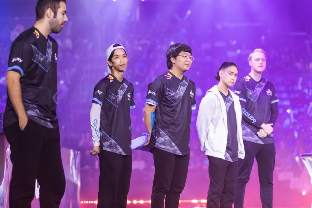 The members of C9 in order of their position—Fudge, Blaber, EMENES, Berserker, and Zven—stand on the LCS Championship finals stage.