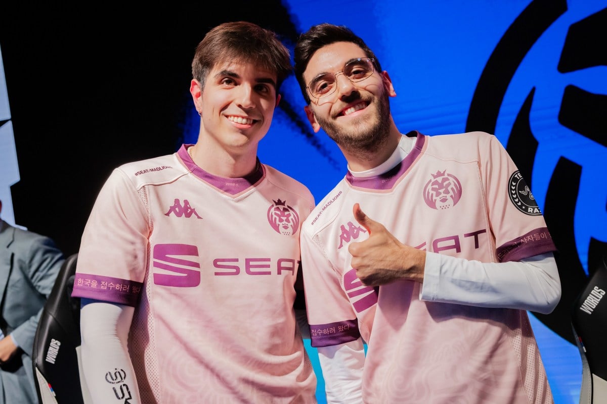 MAD Lions' Nisqy and Elyoya smile for the camera after a MAD Lions win at Worlds 2023