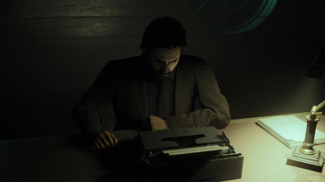 Alan Wake hunched over his typewriter