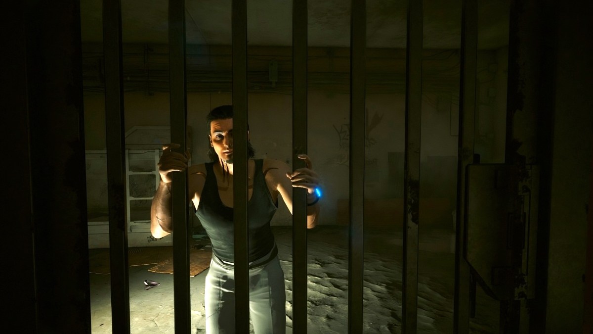 Hasan in a jail-cell during Prototype in the Scraper (Cyberpunk 2077).