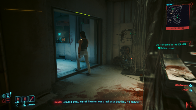 Hasan leading V towards the schematics in Prototype in the Scraper (Cyberpunk 2077).