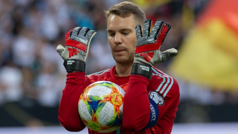 German soccer goalkeeper Manuel Neuer warming up with a ball.