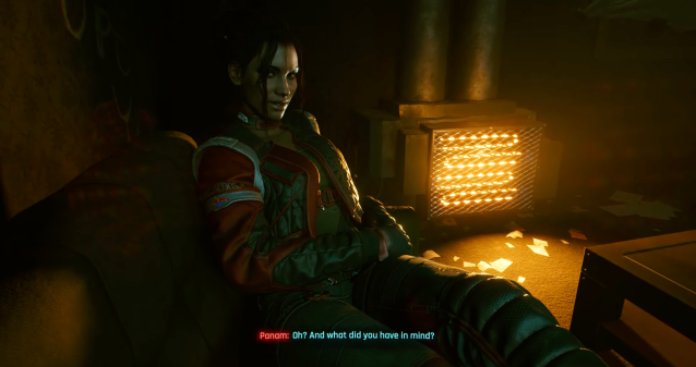 Panam Palmer, a young woman, puts her legs on V flirtatiously n the Riders on the Storm mission in Cyberpunk 2077.