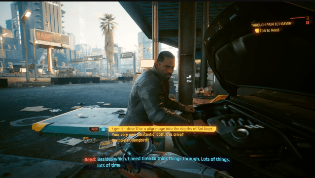 Solomon Reed works on his car in the Through Pain to Heaven quest in Cyberpunk 2077 Phantom Liberty.