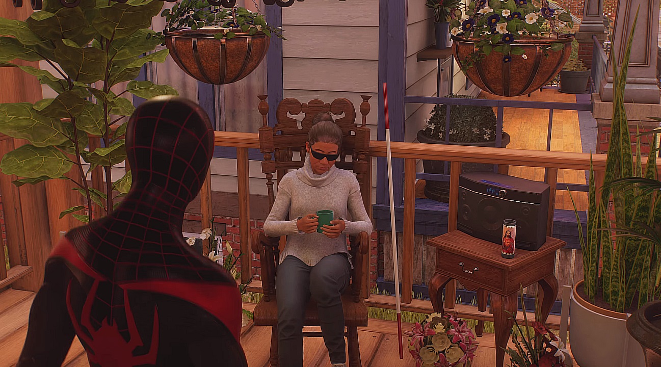 There is a shot of Miles Morales meeting with an old blind woman who is sitting on her porch.