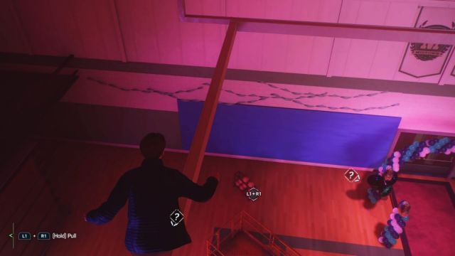 Peter Parker looking down on a rack of basketballs