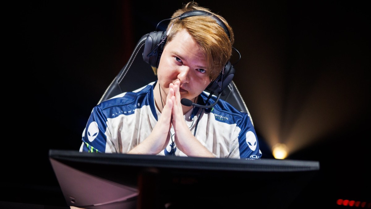 Photo taken of Russian VALORANT pro Redgar while he was playing for Team Liquid at VALORANT Champions 2023. He's looking at the camera and has one hand in front of the other.