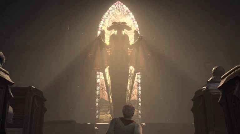 A man praying at a Lilith statue in Diablo 4