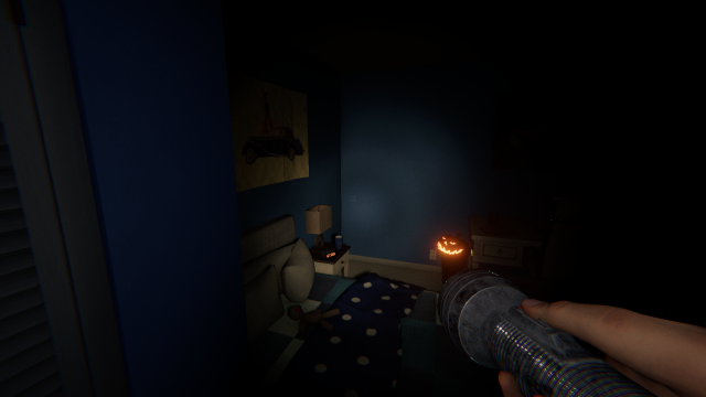 A pumpkin by a desk.