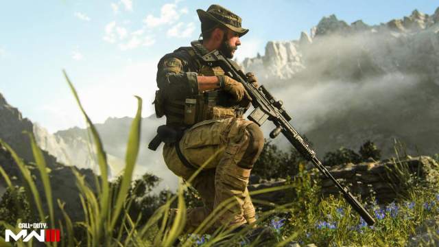 Captain Price holding a suppressed sniper rifle in a mountainous area in MW3.