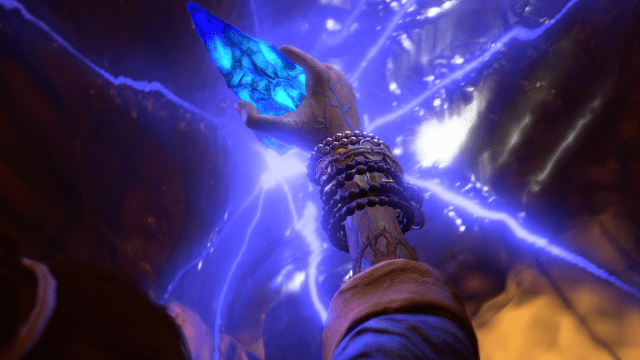 A Diablo 4 character holding a blue gem