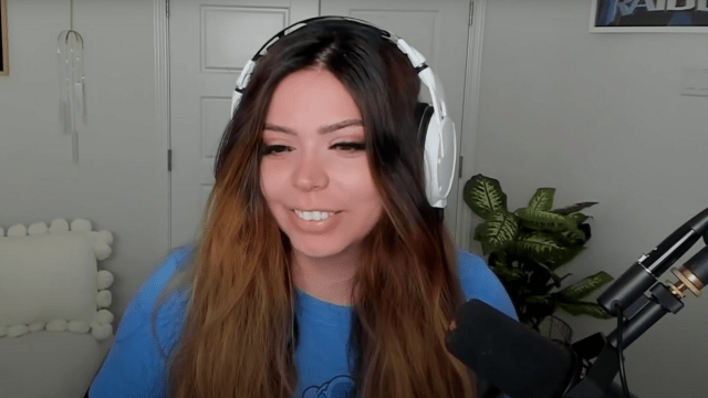 Adeptt looking at her screen while streaming.