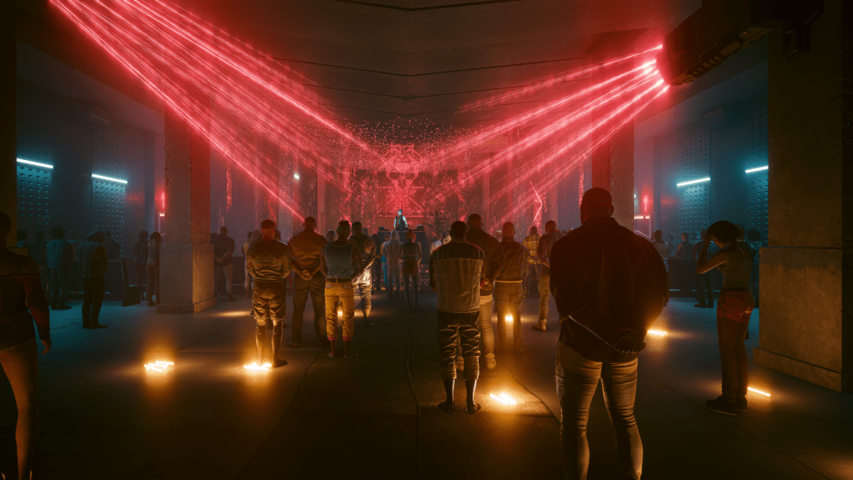 image displays a funeral scene in Cyberpunk 2077, with neon red lights shining down on a memorial in a dark church.