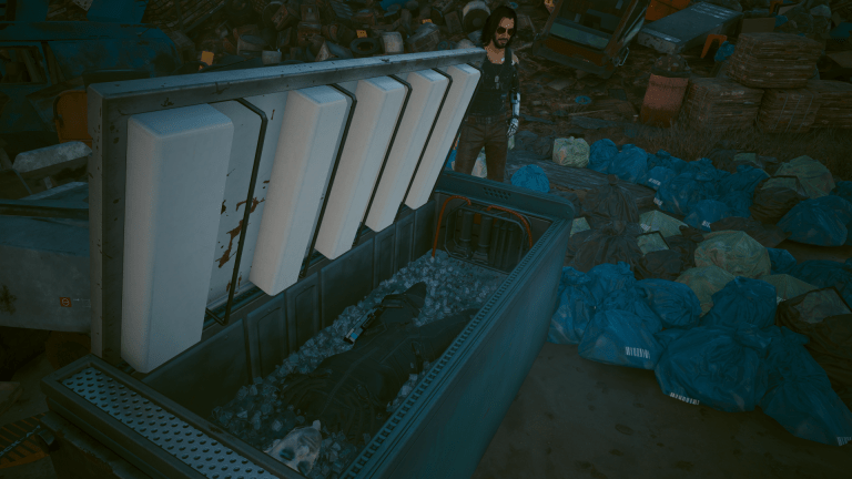 Johnny standing over Bartmoss' corpse in a freezer in Cyberpunk 2077