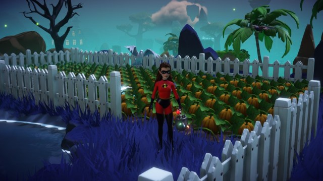 The player standing with a watering can in front of a pumpkin field. 