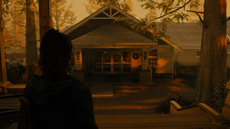 Saga approaching the Wellness Center during a beautiful atmospheric sunset in Alan Wake 2.