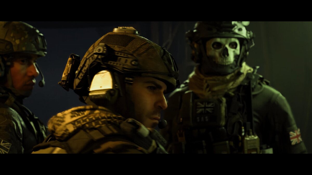 Three soldiers, one wearing a mask with a skull painted on it, stand ready for battle in Call of Duty: Modern Warfare 3 (2023).