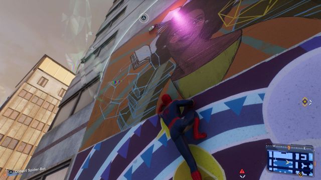 Spider-Man crawling on a mural