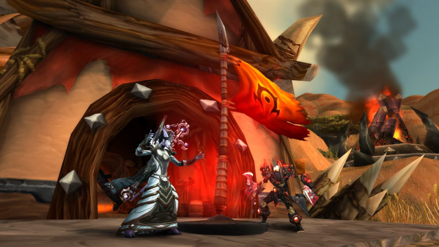 Two WoW players battling it out in Warsong Gulch for the flag