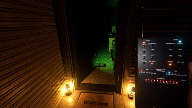 A player holding a Spirit Box while standing outside of the front door of a house.