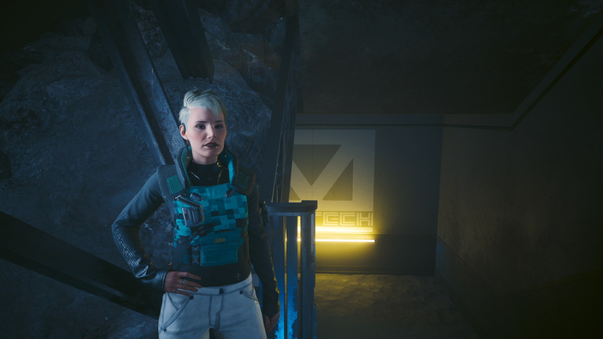 Bree, a reporter in Cyberpunk 2077, standing at the base of a stairwell in an old bunker.