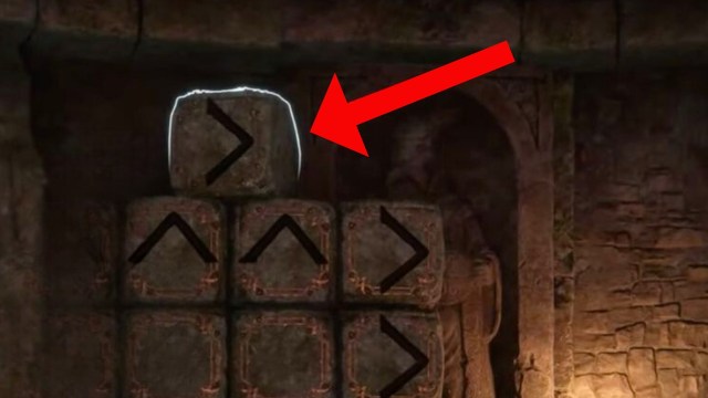 Red arrow pointing to a block on top of other blocks in hogwarts legacy