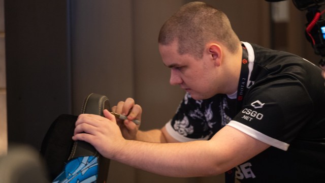 Yatoro signing his chair at Dota 2's TI 2023.