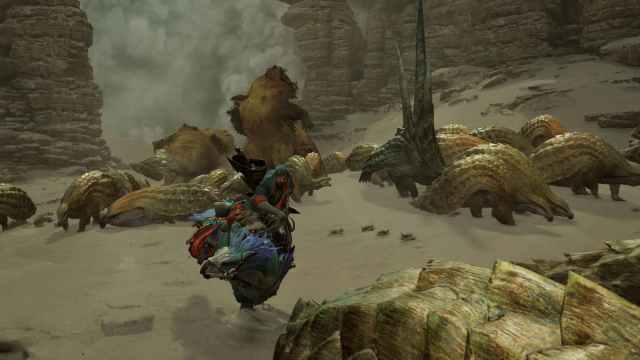 A hunter running through a herd of monsters as a sandstorm rolls through the desert.