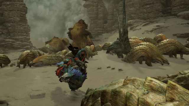 A hunter running through a herd of monsters as a sandstorm rolls through the desert.