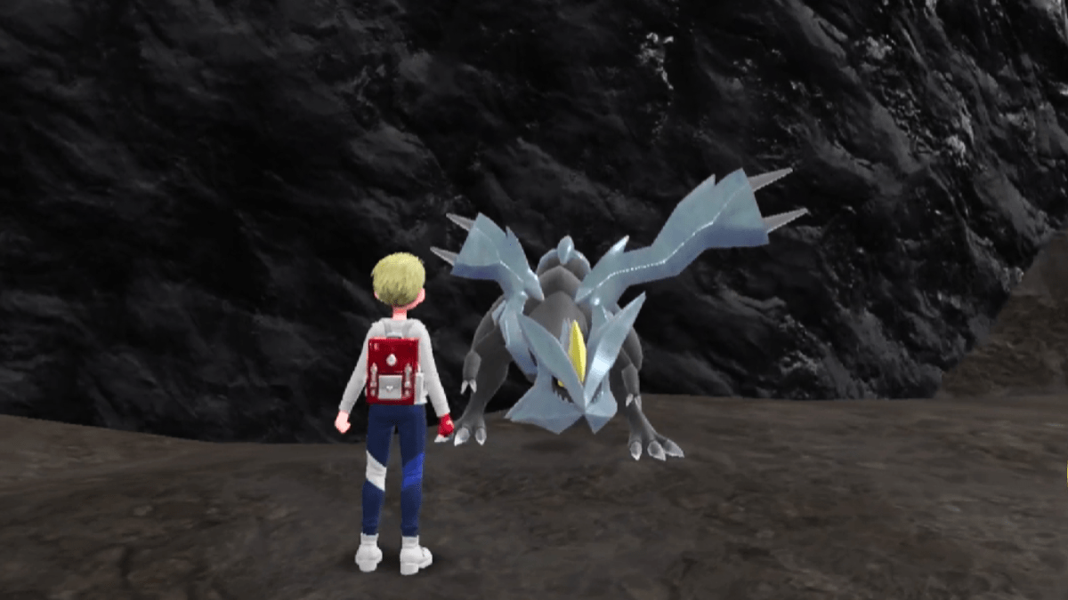 Kyurem standing in front of the trainer in a cave