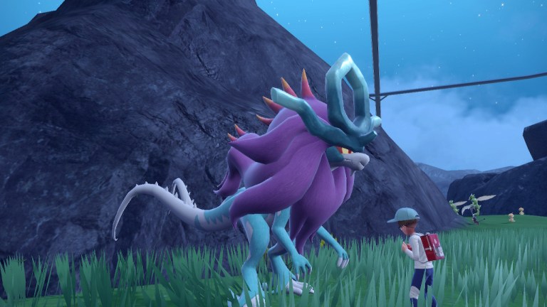 The Pokémon Walking Wake looks down at its trainer in Pokémon Scarlet and Violet.