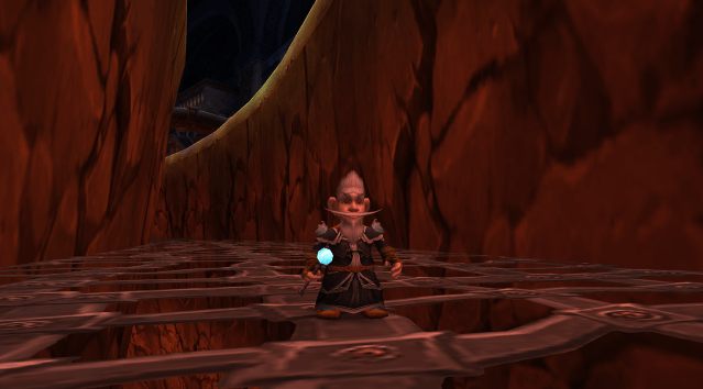 A Gnome Mage stands in the Ironforge chasm in WoW Classic
